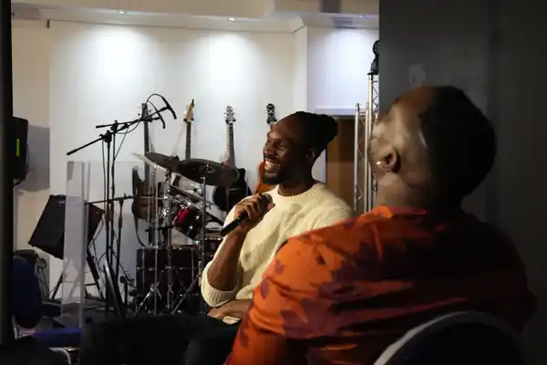 Aiden Saunders speaking with someone in a live conversation setting